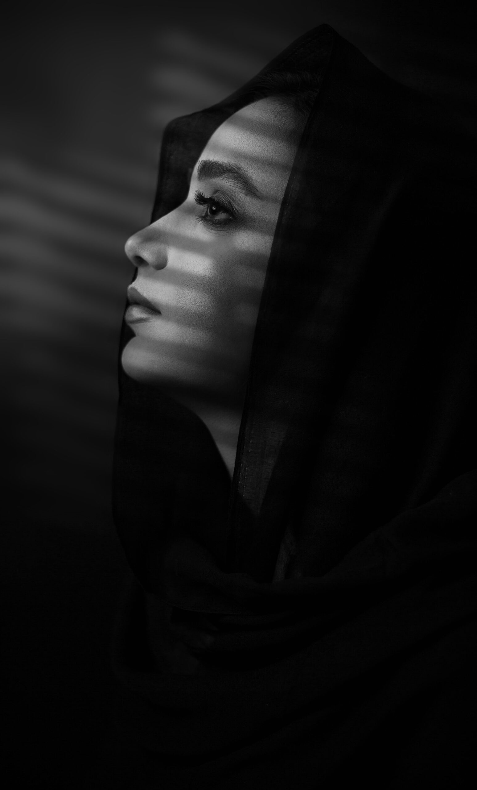 model in black design lace scarf on the head